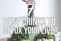 a blender filled with lots of green vegetables on top of a wooden countertop