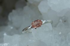 This is a absolutely stunning Oregon Sunstone set in Sterling Silver. Oregon Sunstone is one of the hottest gems on the market today with it's varying colors, patterns and just overall beauty. This particular Oregon Sunstone has a great peachy pink color with a decent shchiller effect! You will surely not be disappointed in this!! Depending upon the lighting, you may see shimmers of the copper shiller which is highly desired! This nicely sized 7mm x 5mm Oval Cut Oregon Sunstone weighs 0.385 cts Pink Gemstones In Fine Jewelry Style, Elegant Sunstone Jewelry, Round Shape, Pink Gemstones With Accent Stones For Gift, Faceted Tourmaline Ring Gift, Round Cut Tourmaline Gemstone Jewelry, Elegant Untreated Oval Gemstones, Untreated Oval Elegant Gemstones, Elegant Round Sunstone Jewelry, Tourmaline Sapphire Ring With Accent Stones As Gift