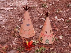 two paper cones are sitting on the ground