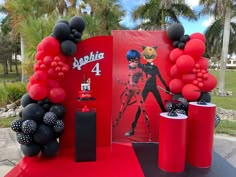 a table with balloons and decorations on it