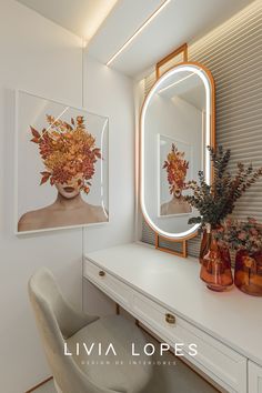 there is a vanity with a mirror and vases on the counter next to it