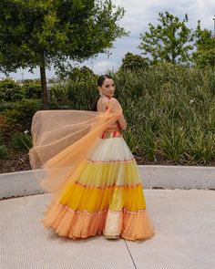 A tulle lehenga with all the shades of sunset paired with a multicolored embroidered blouse.From Liz Paul’s Monet’s Garden collection. DELIVERY TIMEPlease allow 8-12 weeks for your outfit to arrive. FABRIC DETAILSTulle.Professional Cleaning only. Multicolor Organza Anarkali Set For Reception, Spring Festive Multicolor Lehenga, Summer Reception Lehenga With Sheer Dupatta, Summer Reception Lehenga With Dupatta, Multicolor Organza Dress With Traditional Drape, Multicolor Traditional Drape Organza Dress, Multicolor Floor-length Organza Anarkali Set, Spring Multicolor Choli With Dupatta, Multicolor Floor-length Organza Sets