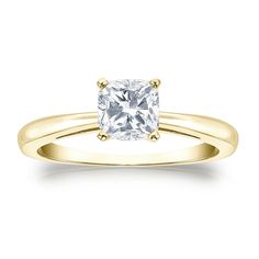 a yellow gold engagement ring with a princess cut diamond in the center and two clawed shoulders