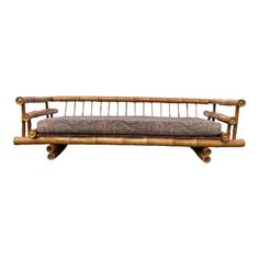 a wooden bench with a cushion on it