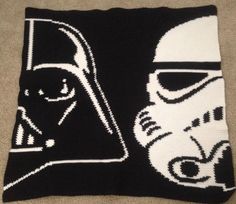 a knitted star wars blanket with a darth vader and stormtrooper on it