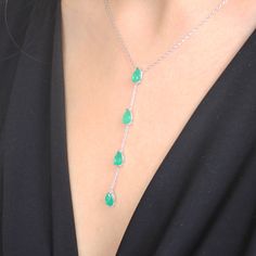 Dazzle with elegance with our 925 Sterling Silver Paraiba Gemstone Y Necklace, featuring a stunning emerald-like appearance that captivates and charms. Elevate your style with our exquisite Paraiba Gemstone Y Necklace, a mesmerizing blend of elegance and sophistication. This handcrafted masterpiece is created with precision and passion, featuring a choice between two stunning versions, each boasting the unparalleled beauty of Paraiba gemstones. Version 1 - Red Paraiba Elegance: Embrace the allur Formal Drop Emerald Gemstone Necklace, Drop Emerald Necklace For Formal Occasions, Elegant Hallmarked Green Emerald Necklace, Elegant Silver Drop Emerald Necklace, Fine Jewelry Silver Pear-shaped Emerald Necklace, Green Drop Emerald Necklace For May Birthstone, Green Emerald Drop Necklace For Formal Occasions, Green Drop Emerald Necklace For Formal Occasions, Elegant Silver Pear-shaped Gemstones