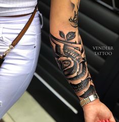 a woman with a tattoo on her arm