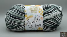 a ball of yarn with the words bundle of love written on it in black and white