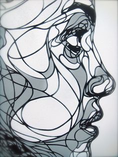 a black and white drawing of a woman's face with wavy lines on it