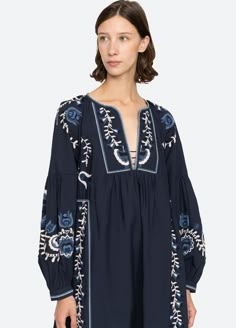 The Inga embroidered dress features long puff sleeves, deep v-neckline and floral embroidery throughout. Details: self-100% cotton lining-100% cotton embroidery-100% polyester slip on designed for a relaxed fit style #AW24-028 model is 5'10'' and wearing a size S Folk Clothing, Sea New York, Long Kimono, Cotton Embroidery, Tunic Styles, Mid Dresses, Long Puff Sleeves, Clothing Care, Peasant Tops