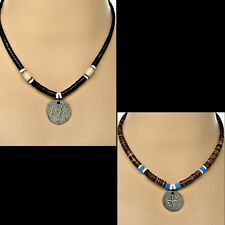 three different necklaces with beads and charms on them, one has a silver cross