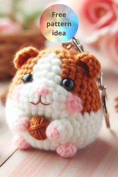 a small crocheted hamster keychain with a free pattern on it