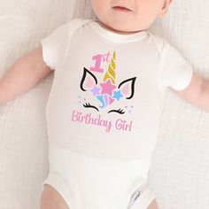 Our pastel unicorn ONESIES® bodysuit is perfect for your unicorn themed 1st birthday party. This would also look adorable with a unicorn cake for a cake smash photoshoot celebrating your one year old! SUPPLIES Each item is handmade using ONESIES® brand by Gerber clothing and are available in the following sizes:  *Newborn *0-3 month *3-6 month *6-9 month *12 month *18 month *24 month A sizing chart is provided in the photos of each listing.  Due to this being a handmade item, there may be slight Pink Fitted Onesie For Birthday, Cute Fitted Bodysuit For Birthday, Fitted Onesie For First Birthday, Unicorn 1st Birthday Party, Unicorn Cake Smash, Unicorn 1st Birthday, Unicorn First Birthday, First Birthday Outfit, Smash Cake Photoshoot