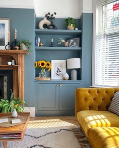 a living room filled with furniture and a fire place