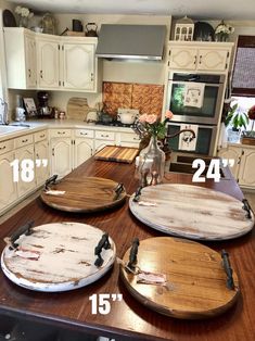 three wooden boards sitting on top of a kitchen counter