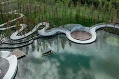 an aerial view of a water park in the woods