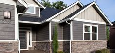 the front of a house with two garages on each side