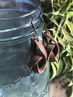 Thank you for stopping by my shop! I adore these leather knot earrings! 💜. No faux leather! Only genuine leather from Little Studio Design Co. *Brown Genuine Leather Knot Earrings--One Pair *approx 1.5inH x .5inW *Antique Bronze Ear Wire-nickel free *Rubber Backings included This is genuine leather with a rustic feel and very lightweight. Need more than one pair?? Message me! https://www.instagram.com/littlestudiodesignco/ More Leather Earrings by Little Studio Design Co: https://etsy.me/2EV3Ap Gold Feather Earrings, Boho Style Earrings, Red Jewelry, Boho Leather, Loop Earrings, Knot Earrings, Hand Tooled Leather, Studio Design, Red Earrings