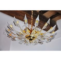 a glass chandelier hanging from the ceiling