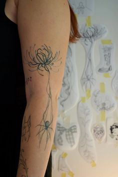 a woman with a tattoo on her arm