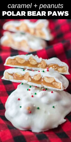 homemade polar bear paw cookies with white icing and sprinkles on top