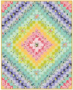 a colorful quilt that has been made with different colors and patterns, including the center