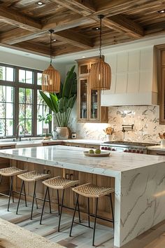 a kitchen with an island and stools in it