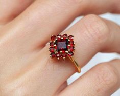 Round garnet ring gold ring garnet antique garnet ring | Etsy Garnet Cluster Promise Ring In Fine Jewelry Style, Garnet Cluster Ring For Promise, Fine Jewelry, Fine Jewelry Garnet Cluster Ring With Gemstones, Garnet Gemstone Cluster Ring In Fine Jewelry Style, Formal Garnet Gemstone Cluster Ring, Garnet Gemstone Cluster Ring Gift, Yellow Gold Garnet Cluster Ring As Gift, Heirloom Garnet Cluster Ring With Gemstones, Burgundy Garnet Gemstone Ring