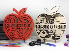 there are two wooden signs that say, mr and mrs deceito with an apple