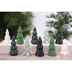 small wooden christmas trees in various colors and sizes