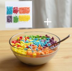 a bowl filled with cereal sitting on top of a wooden table next to a card