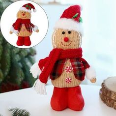 a knitted snowman ornament with a red scarf and hat