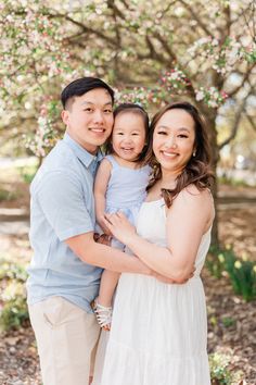 Man and woman and toddler girl posing for spring family photos in blue and white outfits White Family Photo Outfits, Family Photoshoot With Toddler, Photoshoot With Toddler, Family Photo Outfits Spring, Family Pregnancy Photoshoot, Spring Family Photoshoot, 1st Photoshoot, Spring Family Photos, Minnesota Landscape