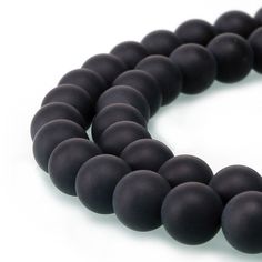 a black beaded bracelet with round beads