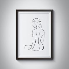 a black and white drawing of a woman's body in a frame on the wall