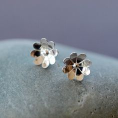 Reminiscent of the sweet flowers of the Chamomile plant, these cupped floral stud earrings are crafted entirely of sterling silver. These sweet silver post earrings are perfect for everyday wear. The face of the flower measures 1cm in diameter. The earrings come with sterling silver wingnut backs, as shown. Chamomile Flower, Cute Stud Earrings, Silver Flower Earrings, Mini Earrings, Floral Studs, Silver Post Earrings, Floral Jewelry, Casual Jewelry, Tiny Earrings