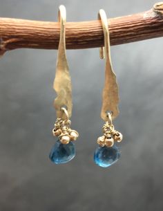 Handmade with 14K hammered solid gold and tiny, diamond cut gold beads and topaz stones. Each piece may vary slightly, due to its handmade nature. Handmade Gold Earrings With Blue Topaz, Earrings Hanging, Jewelry Delicate, Natural Stone Earrings, Ocean Jewelry, Jewelry Blue, Hammered Gold, Topaz Earrings, Blue Gems