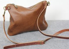 "Leather crossbody bag, brown crossbody bag, brown leather purse, brown handbag, leather women bag This perfect size leather crossbody bag has two inner pockets, one which zips closed and one slip pocet for your phone. The satchel is made from soft italian leather, lined with cotton lining for secure. It's designed it to be classy and minimal to match with any outfit. * Made from genuine Italian leather. * Adjustable crossbody strap. * 2 inner pockets. * Size: H 8\" x W 11\" - 20x28 cm Caution. Distressed Brown Crossbody Shoulder Bag For Everyday Use, Brown Textured Leather Crossbody Saddle Bag, Brown Textured Leather Saddle Crossbody Bag, Vintage Brown Crossbody Saddle Bag For Everyday Use, Textured Leather Brown Clutch Shoulder Bag, Vintage Brown Soft Leather Crossbody Shoulder Bag, Vintage Brown Soft Leather Crossbody Bag, Tan Leather Handbags, Brown Leather Purse