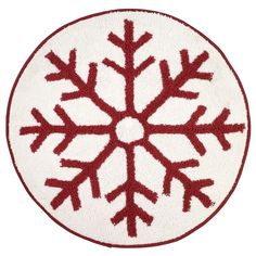 a red and white snowflake rug on a white background with the word,'christmas