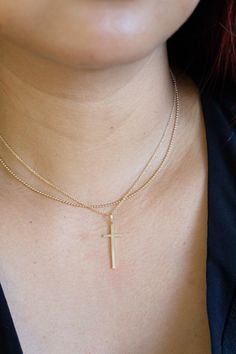 Wear your faith with this elegant cross necklace in a cable chain. - chain available in 16, 18, and 20 inches. Chain length can be customized. - approx. cross size : 10x26mm - 14K solid yellow gold Sustainably handmade in Los Angeles 14k Gold Cross Necklace With Delicate Chain, Cross Pendant Necklace With Cable Chain As Gift, 14k Gold Delicate Chain Cross Necklace, Original Necklace, 16 Inch Necklace, Gold Cross Necklace, Rancho Cucamonga, Gold Necklace Layered, Station Necklace