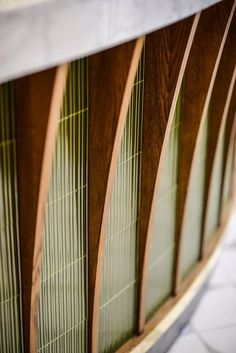 close up view of wood and glass panels on a building's side window sill