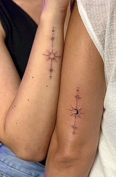 two people with tattoos on their arms