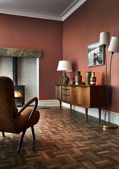 a living room filled with furniture and a fire place