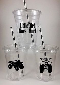 three cups with black and white striped straws in front of each other, one has an atv on it