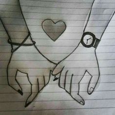 two hands holding each other with a heart on their wrist