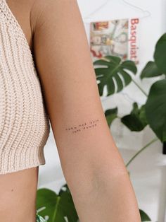 a woman with a small tattoo on her arm