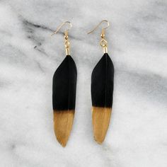 These elegant feather earrings are perfect for a wedding or any night out!+ lightweight black goose and duck feathers with gold dipped detail+ gold-plated stainless steel ear wire hooks (lead-free and nickel-free)+ comes with plastic earring back for security+ available in BIG (4 inch long) and BIGGER (5 inch long) styles+ BIG is about .75" to 1" wide, BIGGER is 1.5" to 2" wide   (each piece is handmade and feathers are natural so variations in size do occur)+ packaged on a hand-stamped kraft ea Adjustable Black Feather Jewelry, Bohemian Black Feather Earrings, Elegant Black Feather Jewelry, Gold Feather Earrings, Black Duck, Decades Of Fashion, Earring Card, Plastic Earrings, Gold Feathers