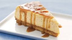 a piece of cheesecake with caramel drizzle on top