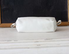 "The rectangular pencil case in white soft sheep leather. This pencils case was made to carry around your purse. Customize it in fabric or leather in your favorite color combination and why not mix and match it with one of the other bags in my shop http://etsy.me/1haNFVO Inside the bag, the lining is made using a cotton floral fabric. The top closes using a nylon zipper with silver colored hardware. Aprox. dimensions: The bottom is measuring 7\" x 5\" (18cm x 5cm) and the height of this pouch is White Rectangular Pencil Case For Everyday Use, Rectangular White Travel Pencil Case, White Pencil Case With Zipper, White Pencil Case Pouch For Everyday Use, White Pouch Pencil Case For Daily Use, White Zipper Pouch Pencil Case, White Pouch Pencil Case For Everyday Use, White Zipper Pouch Pencil Case For Everyday, White Rectangular Zipper Pencil Case