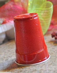 a red plastic cone sitting on top of a counter